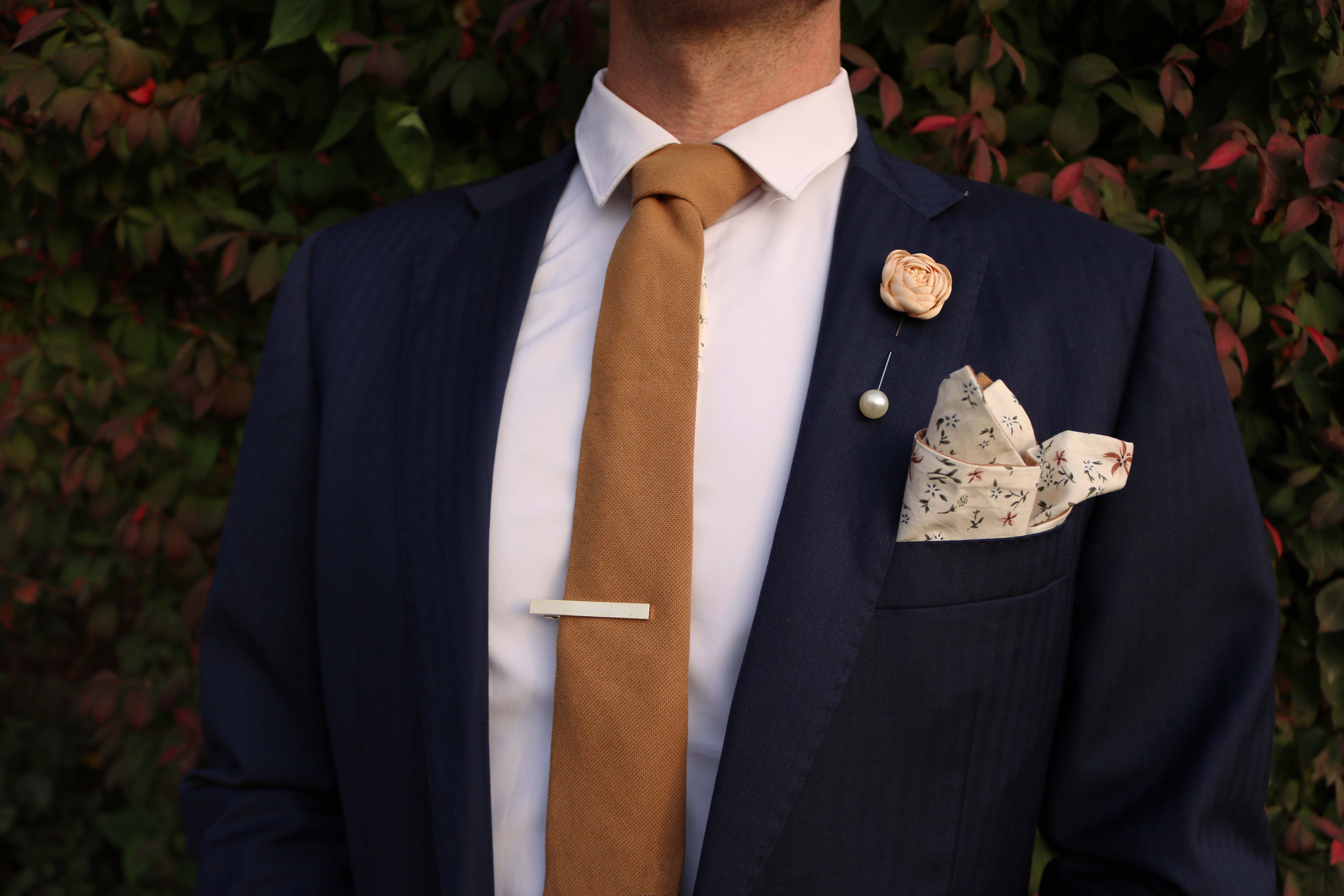 navy suit rust tie